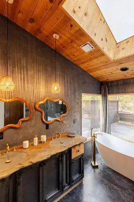 a bathroom with a tub and a large sink at River Soul – Riverfront Luxury & Stunning Views in Three Rivers