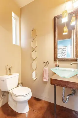a bathroom with a toilet and a sink at Sequoia Arquitectural Wonder with Hot Tub & Views in Three Rivers