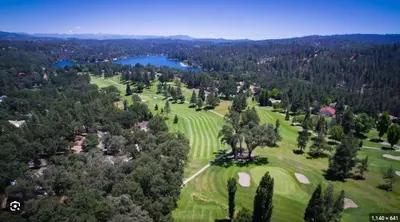 an aerial view of a park with trees and a lake at Serenity View, Peaceful & Cheerful 3BD Cabin in Groveland