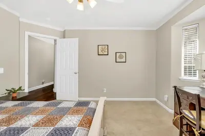 a white bedroom with a bed and a window at Awesome Views Game Room Hot Tub and More in Oakhurst
