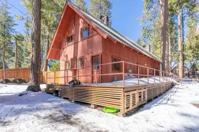 a cabin in the woods in the snow at Rustic Knotty Pine - Old Cabin Vibes in Shaver Lake