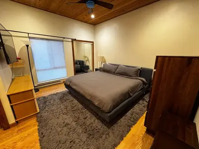 a bedroom with a bed and a ceiling fan at Spacious Condo walking distance to Hyatt and Beaches in Incline Village