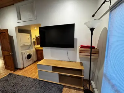 a living room with a flat screen tv on a wall at Spacious Condo walking distance to Hyatt and Beaches in Incline Village