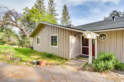 a small house with a driveway in front of it at Sierra Serenity Scenic Mtn Escape with Game Room in Oakhurst