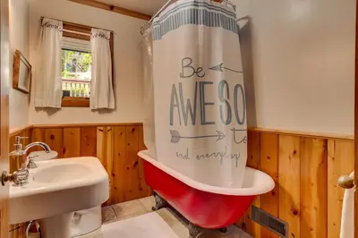 a bathroom with a red and white shower curtain at Hyphen 5-bedrooms rental, private beach, filtered view in Tahoe City