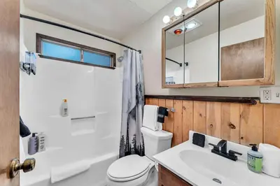 a bathroom with a toilet and a sink at Spacious Truckee Retreat with Fireplace & Deck in Truckee