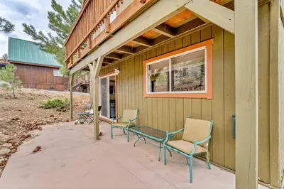 a porch with chairs and a window on a house at Spacious Truckee Retreat with Fireplace & Deck in Truckee