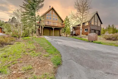 an empty road in front of a house at Spacious Truckee Retreat with Fireplace & Deck in Truckee