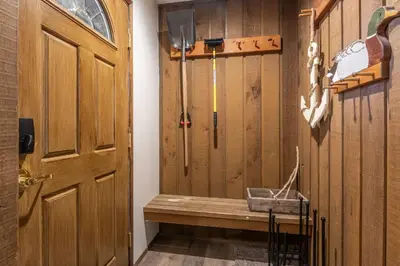 a room with a bench next to a door at Ground Level, Sunshine Village #171- 2 bed/2 bath, Sleeps 6. Steps from Free Town Shuttle in Mammoth Lakes