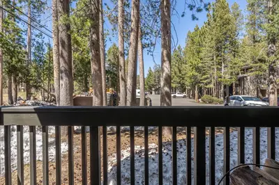 a view from the balcony of a park with trees at Ground Level, Sunshine Village #171- 2 bed/2 bath, Sleeps 6. Steps from Free Town Shuttle in Mammoth Lakes