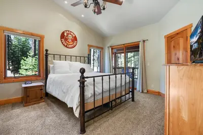 a bedroom with a bed and a window at WSH1030 - Camp Westwater home in Tahoma