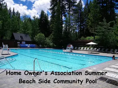 a large swimming pool in a resort withhome owners association summer beach side at WSH1030 - Camp Westwater home in Tahoma