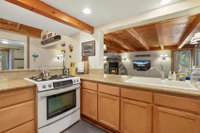 a kitchen with a stove and a sink at WSH1030 - Camp Westwater home in Tahoma