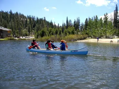 a group of people in a blue canoe on a lake at Updated Winter Getaway Great for Skiing in Soda Springs, California in Soda Springs