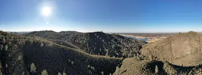 an aerial view of a forested mountain range at Safari Tents for Romantic Escapes in California's El Dorado County in Pilot Hill