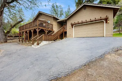 a house with a garage and a driveway at Harmony Haven in Groveland