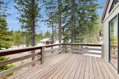 a wooden porch of a house with trees at Peace and Pines at Upper Ward Creek in Tahoe City