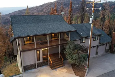 an aerial view of a house with a cross at Charming and Relaxing Getaway with Great Views in Shaver Lake