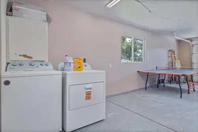 a kitchen with a stove and a table at Green Meadows at Sky Ranch, 13 miles from Yosemite in Oakhurst