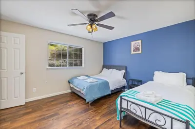 a bedroom with two beds and a ceiling fan at Sunset Lookout Mountain villa, Meadows, Gazebo in Coarsegold