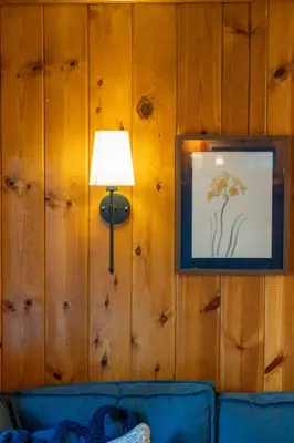 a picture of a flower on a wall with a lamp at Piece of Paradise Dream Deck AC in Shaver Lake