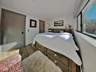 a bedroom with a large bed and a window at 1849 Condos 642 home in Mammoth Lakes