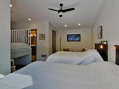 a bedroom with two beds and a ceiling fan at 1849 Condos 642 home in Mammoth Lakes
