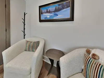 a living room with a couch and a chair at 1849 Condos 642 home in Mammoth Lakes