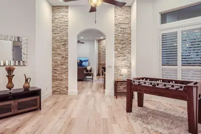 a living room with a foosball table in it at Beautiful Granite Bay Home near Folsom Lake in Granite Bay