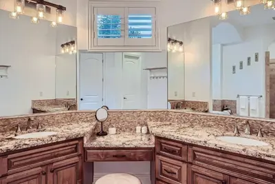 a bathroom with two sinks and a large mirror at Beautiful Granite Bay Home near Folsom Lake in Granite Bay