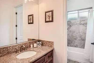 a bathroom with a sink and a mirror at Beautiful Granite Bay Home near Folsom Lake in Granite Bay