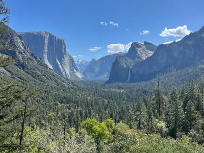 a view of a valley with mountains and trees at The Mountains are Calling - Private, Guesthouse Retreat near Yosemite in Ahwahnee