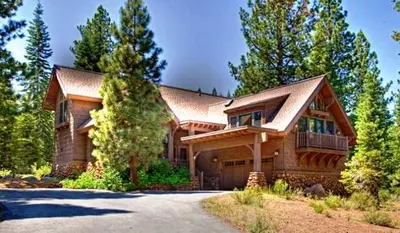 a large wooden house in the woods at Modern Woodland Cabin Getaway with a Fireplace in Truckee, California in Truckee