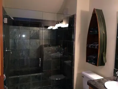 a bathroom with a shower and a sink at Modern Woodland Cabin Getaway with a Fireplace in Truckee, California in Truckee