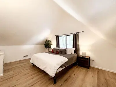 a bedroom with a bed and a window at Fabulous Glamping Spot in Truckee, California: Charming Cabin near Lake Donner in Truckee
