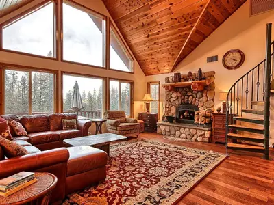 a living room with a couch and a fireplace at Gorgeous Vacation Rental with Hot Tub near Yosemite National Park, California in Mariposa