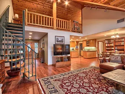 a large living room with a staircase and a living room at Gorgeous Vacation Rental with Hot Tub near Yosemite National Park, California in Mariposa