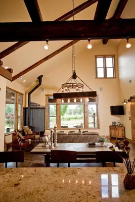 a living room with a table and a couch at Exquisite Cottage Rental on Peaceful Vineyard near Bear Valley, California in Angels Camp