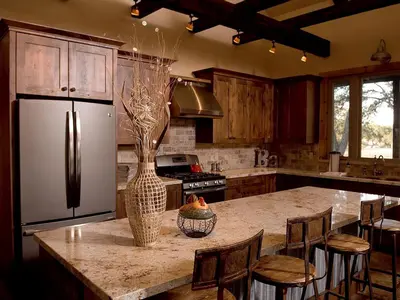 a kitchen with a refrigerator and a table with chairs at Exquisite Cottage Rental on Peaceful Vineyard near Bear Valley, California in Angels Camp