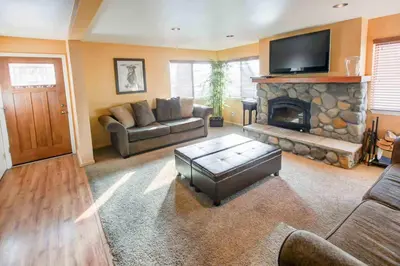 a living room with a couch and a fireplace at San Sierra #16 Hot Tub Sauna Near Skiing in Mammoth Lakes