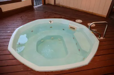 a jacuzzi tub sitting on a wooden floor at San Sierra #16 Hot Tub Sauna Near Skiing in Mammoth Lakes