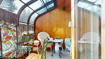 a room with tables and chairs and a window at Serene Sierra Sanctuary Experience Mammoth Magic in Mammoth Lakes