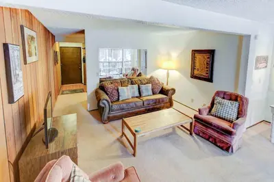 a living room with a couch and two chairs at Sherwin Villas Free Shuttle & Near Skiing in Mammoth Lakes