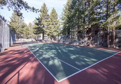 a tennis court with a net on it at Sherwin Villas Free Shuttle & Near Skiing in Mammoth Lakes