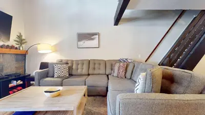 a living room with a couch and a coffee table at Sherwin Villas Retreat DT in Mammoth Lakes