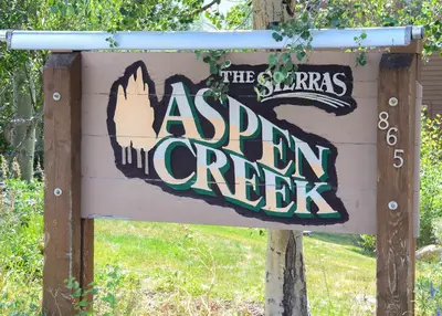 a sign for the asian green creeks at Aspen Creek #204 Near Golf Fishing & Hiking in Mammoth Lakes