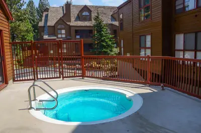 a small pool in front of a house at Aspen Creek #225 Hot Tub & Pool Near Skiing in Mammoth Lakes