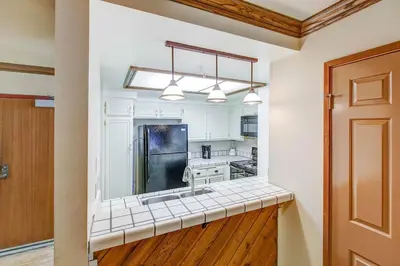 a kitchen with a sink and a counter top at Aspen Creek #225 Hot Tub & Pool Near Skiing in Mammoth Lakes