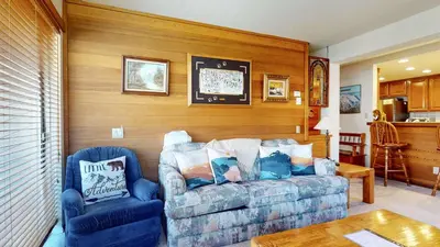 a living room with a couch and a chair at Walk to Mammoth Ski Lifts at Canyon Lodge Condo in Mammoth Lakes
