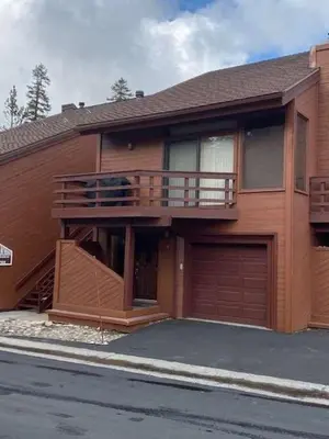 a large house with a balcony and a garage at Canyon Ski & Racquet #1 Near Hike & Bike Trails in Mammoth Lakes